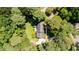 Aerial view of a home featuring mature trees, a well-manicured lawn and a long driveway at 10625 Soma Ct, Raleigh, NC 27613