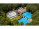 Community amenities with a large pool, lounge chairs, tennis courts and parking at 10625 Soma Ct, Raleigh, NC 27613