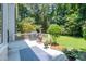 A home's deck featuring an outdoor grill, a chiminea, a blue rug, and potted plants at 10625 Soma Ct, Raleigh, NC 27613