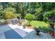 A home's deck featuring an outdoor grill, a chiminea, a blue rug, and potted plants at 10625 Soma Ct, Raleigh, NC 27613