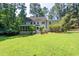 Large backyard featuring a screened-in porch and a well-maintained lawn, perfect for outdoor gatherings and activities at 10625 Soma Ct, Raleigh, NC 27613