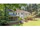 A home's backyard featuring a lush lawn, patio, and sunroom at 10625 Soma Ct, Raleigh, NC 27613