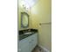 Powder room with granite countertop, stylish vanity, and decorative mirror creating a sophisticated space at 10625 Soma Ct, Raleigh, NC 27613