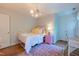 Charming bedroom with vintage furniture, colorful accents, hardwood floors, and great natural light at 10625 Soma Ct, Raleigh, NC 27613