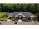 Community clubhouse, with American flag, landscaping and parking at 10625 Soma Ct, Raleigh, NC 27613