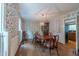 Traditional dining room with wood floors, wallpaper, and a stylish light fixture at 10625 Soma Ct, Raleigh, NC 27613