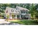 Charming two-story home featuring classic black shutters, dormer windows and a well-maintained, landscaped yard at 10625 Soma Ct, Raleigh, NC 27613