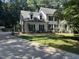 Charming two-story home with a well-maintained lawn and mature trees at 10625 Soma Ct, Raleigh, NC 27613