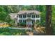 Traditional two-story home with black shutters and lush green landscaping offering great curb appeal at 10625 Soma Ct, Raleigh, NC 27613