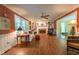 Cozy living room with a fireplace, built-in shelves, and wood floors at 10625 Soma Ct, Raleigh, NC 27613