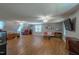 Large living room with hardwood floors, modern seating, and great natural light at 10625 Soma Ct, Raleigh, NC 27613