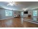 Open living area featuring hardwood floors, natural light, and entertainment space at 10625 Soma Ct, Raleigh, NC 27613