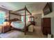 Spacious main bedroom with a large bed, traditional-style furnishings, and lots of natural light at 10625 Soma Ct, Raleigh, NC 27613
