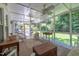 Bright screened porch with cozy seating, perfect for enjoying the outdoors at 10625 Soma Ct, Raleigh, NC 27613