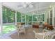 Charming screened porch featuring ceiling fans and ample seating at 10625 Soma Ct, Raleigh, NC 27613