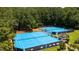 Outdoor tennis courts, with surrounding fences and lush landscaping at 10625 Soma Ct, Raleigh, NC 27613