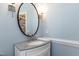 Half bath with granite countertop, modern fixtures, and updated lighting at 107 Quarter Path, Cary, NC 27518