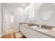 Bright bathroom features a double vanity, modern fixtures, and a well-lit mirror for a clean and stylish look at 107 Quarter Path, Cary, NC 27518