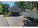 View of the detached garage and driveway at 107 Quarter Path, Cary, NC 27518