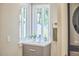 Close-up of bathroom vanity with natural light and modern fixtures at 108 Cedar St, Chapel Hill, NC 27514