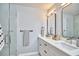 Bright bathroom featuring double vanity with modern fixtures and a glass-enclosed shower at 108 Cedar St, Chapel Hill, NC 27514