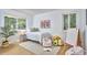 Bright bedroom with a queen bed, colorful artwork, and ample natural light at 108 Cedar St, Chapel Hill, NC 27514