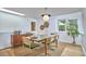 The dining room features a glass table, sleek lighting, and neutral decor at 108 Cedar St, Chapel Hill, NC 27514
