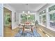 Open dining area with modern lighting, and access to the deck at 108 Cedar St, Chapel Hill, NC 27514
