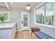 Bright eat-in kitchen area with hardwood floors and access to outdoor deck at 108 Cedar St, Chapel Hill, NC 27514