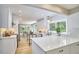 Bright, open kitchen with white cabinetry, stainless appliances, and eat-in dining area at 108 Cedar St, Chapel Hill, NC 27514