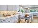 Kitchen featuring white cabinets and countertops and stainless steel appliances at 108 Cedar St, Chapel Hill, NC 27514