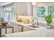 Bright kitchen featuring white countertops, and updated backsplash at 108 Cedar St, Chapel Hill, NC 27514
