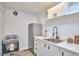 Cozy kitchenette with stainless steel appliances, marble countertop and white cabinets at 108 Cedar St, Chapel Hill, NC 27514