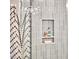 Close up of shower niche with light green tiled walls holding decorative items at 108 Cedar St, Chapel Hill, NC 27514