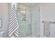 Shower with glass enclosure with light green tiled walls with a built-in niche at 108 Cedar St, Chapel Hill, NC 27514