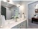 Bathroom featuring double sinks, white cabinetry, and neutral paint at 109 Fox Trap Ct, Garner, NC 27529