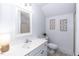 Bright bathroom featuring modern vanity, artwork, shower with glass enclosure, and neutral tones at 109 Fox Trap Ct, Garner, NC 27529