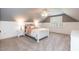 Cozy bedroom featuring a ceiling fan, white wainscoting, and shuttered windows at 109 Fox Trap Ct, Garner, NC 27529