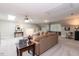 Well-lit bonus room with skylights, cozy seating, and neutral tones at 109 Fox Trap Ct, Garner, NC 27529