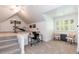 Bright bonus room featuring a desk, exercise equipment, and neutral decor at 109 Fox Trap Ct, Garner, NC 27529