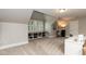 Bonus room with built-in storage, cozy seating, and natural light at 109 Fox Trap Ct, Garner, NC 27529