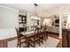 Spacious dining room with hardwood floors that opens to the living room at 109 Fox Trap Ct, Garner, NC 27529