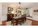 Bright dining room with a modern light fixture and a cozy window seat at 109 Fox Trap Ct, Garner, NC 27529
