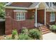 Charming brick home featuring a welcoming front entrance with manicured landscaping and decorative brickwork at 109 Fox Trap Ct, Garner, NC 27529
