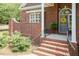 Close-up of the entryway featuring a gray door, and beautiful brickwork at 109 Fox Trap Ct, Garner, NC 27529