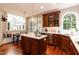 An open kitchen with a central island, stainless appliances, and adjacent dining area at 109 Fox Trap Ct, Garner, NC 27529