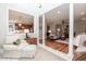 Bright living room with wood floors, large columns, and a passthrough into the kitchen at 109 Fox Trap Ct, Garner, NC 27529