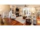 Spacious living room features a fireplace, built-in shelving, and hardwood floors at 109 Fox Trap Ct, Garner, NC 27529