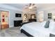 Elegant primary bedroom featuring a ceiling fan, crown moulding, and ensuite bathroom at 109 Fox Trap Ct, Garner, NC 27529