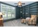 A home office featuring floor-to-ceiling built in shelving and large window at 109 Fox Trap Ct, Garner, NC 27529